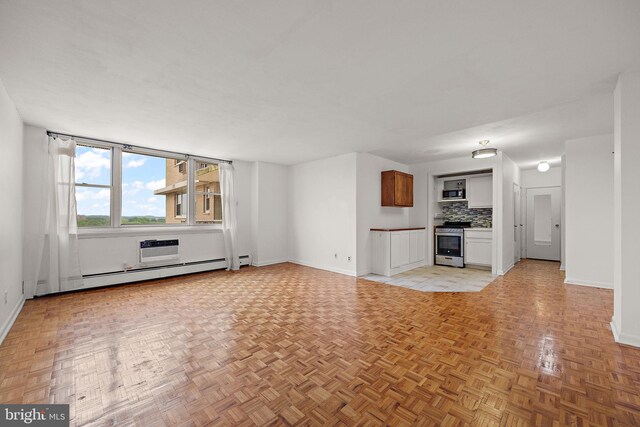 1301 N Harrison St Unit 1106, Wilmington, DE 19806 - unfurnished living room with a baseboard heating unit and baseboards