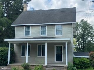 189 Rolling Stone Rd, Kylertown, PA 16847 - view of front of home with covered porch and a chimney