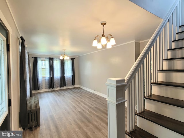 189 Rolling Stone Rd, Kylertown, PA 16847 - foyer entrance featuring a chandelier, wood finished floors, crown molding, and stairs
