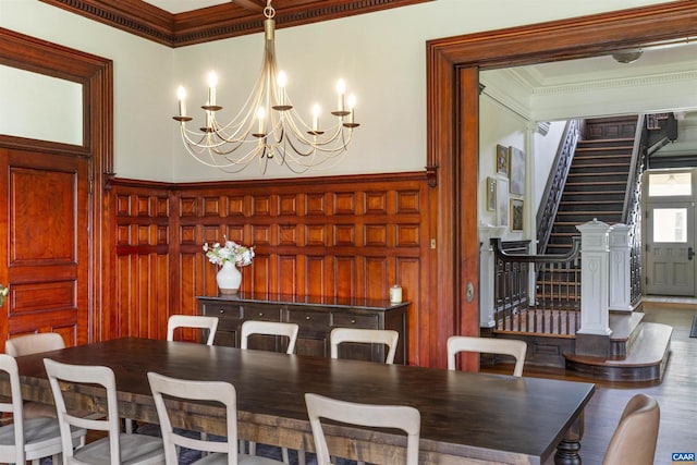 2024 Rivermont Ave, Lynchburg, VA 24503 - dining area featuring crown molding, a decorative wall, a chandelier, stairs, and wainscoting