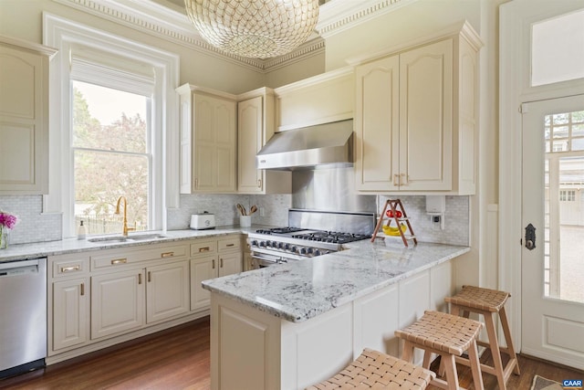 2024 Rivermont Ave, Lynchburg, VA 24503 - kitchen with dishwasher, exhaust hood, stove, wood finished floors, and a peninsula
