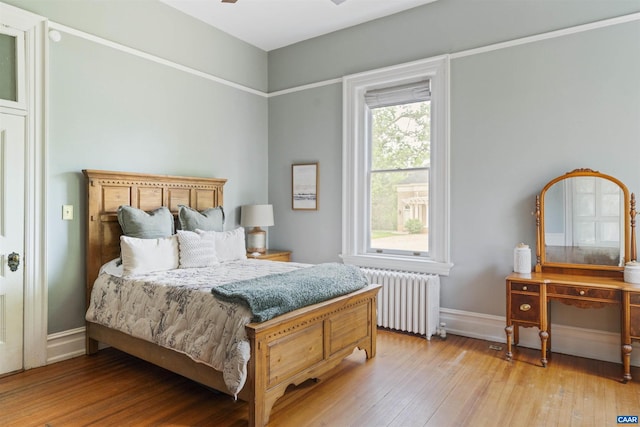 2024 Rivermont Ave, Lynchburg, VA 24503 - bedroom featuring radiator heating unit and light wood-type flooring