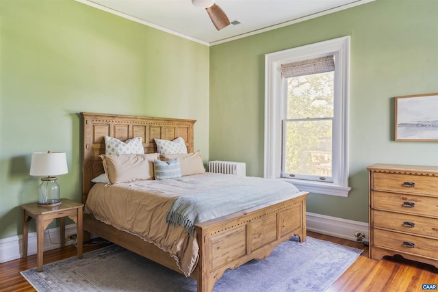 2024 Rivermont Ave, Lynchburg, VA 24503 - bedroom with radiator heating unit, crown molding, wood finished floors, and ceiling fan
