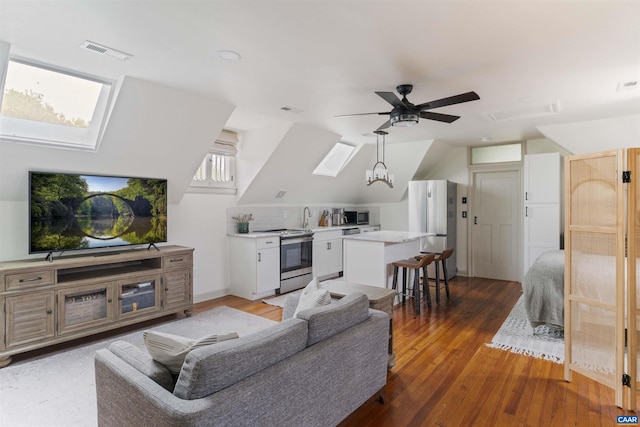 2024 Rivermont Ave, Lynchburg, VA 24503 - living room featuring a ceiling fan, a skylight, light wood-style floors, and lofted ceiling