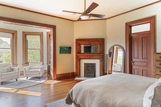 2024 Rivermont Ave, Lynchburg, VA 24503 - bedroom featuring wood finished floors, crown molding, ceiling fan, and arched walkways