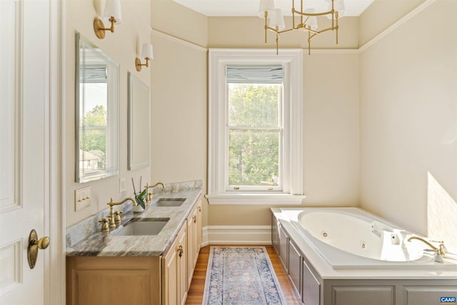 2024 Rivermont Ave, Lynchburg, VA 24503 - full bath featuring a chandelier, double vanity, a tub with jets, and wood finished floors
