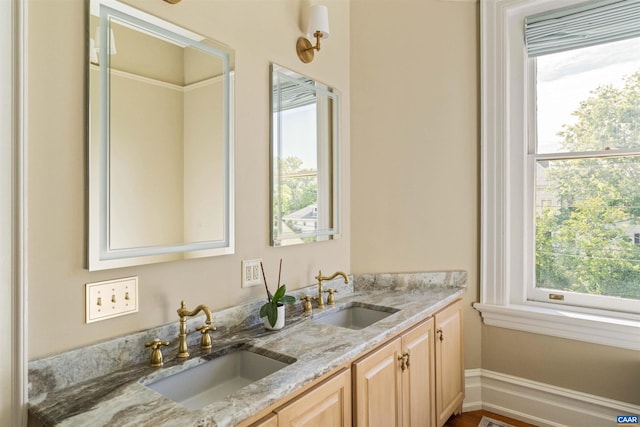 2024 Rivermont Ave, Lynchburg, VA 24503 - bathroom with double vanity and healthy amount of natural light