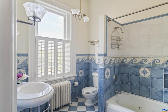 2024 Rivermont Ave, Lynchburg, VA 24503 - bathroom featuring radiator, tile walls, wainscoting, and a combined bath / shower with jetted tub