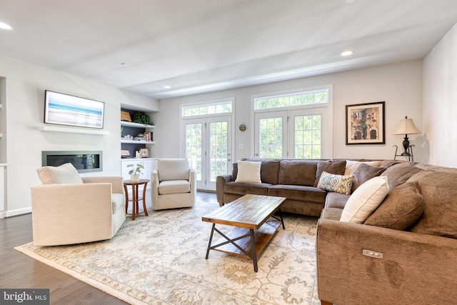 6006 Charles Xing, Ellicott City, MD 21043 - living area with wood finished floors, recessed lighting, a glass covered fireplace, and built in features