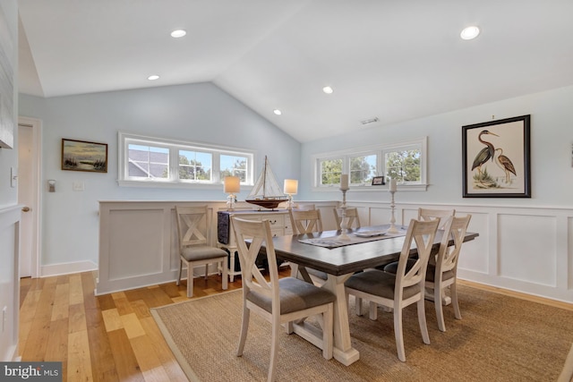 1510 N Bay Shore Dr, Milton, DE 19968 - dining room featuring a wainscoted wall, light wood-style floors, lofted ceiling, a decorative wall, and recessed lighting