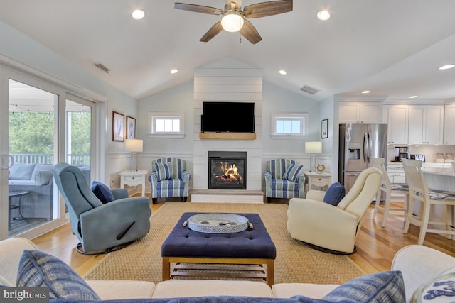 1510 N Bay Shore Dr, Milton, DE 19968 - living area with lofted ceiling, plenty of natural light, light wood-style floors, a ceiling fan, and recessed lighting