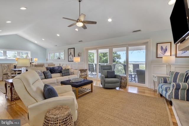 1510 N Bay Shore Dr, Milton, DE 19968 - living room with vaulted ceiling, light wood-style flooring, a ceiling fan, a wainscoted wall, and recessed lighting