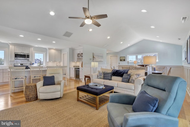 1510 N Bay Shore Dr, Milton, DE 19968 - living room featuring healthy amount of natural light, a ceiling fan, light wood-style floors, lofted ceiling, and recessed lighting