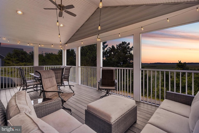 1510 N Bay Shore Dr, Milton, DE 19968 - deck at dusk with a ceiling fan, outdoor dining space, and an outdoor hangout area