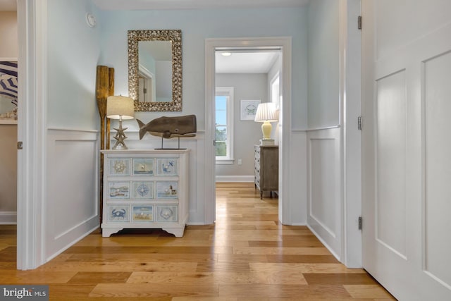 1510 N Bay Shore Dr, Milton, DE 19968 - hall with light wood-style flooring, a decorative wall, and a wainscoted wall