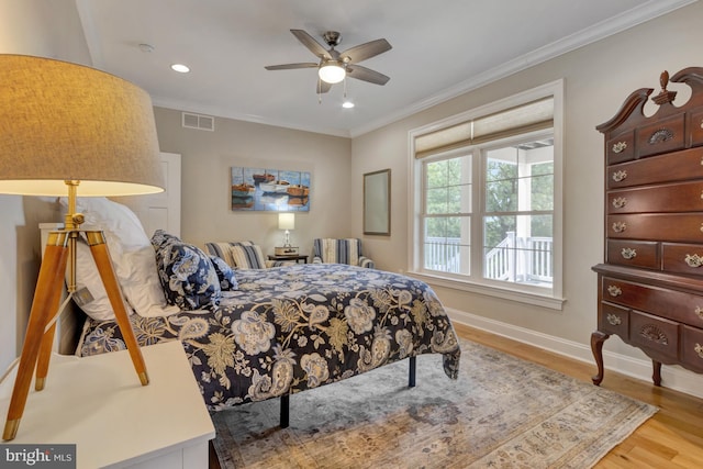 1510 N Bay Shore Dr, Milton, DE 19968 - bedroom featuring wood finished floors, ornamental molding, recessed lighting, and a ceiling fan