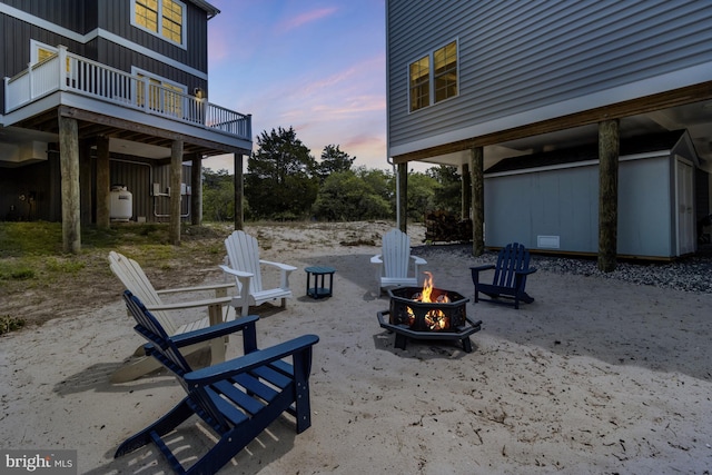 1510 N Bay Shore Dr, Milton, DE 19968 - yard at dusk with a fire pit and a deck