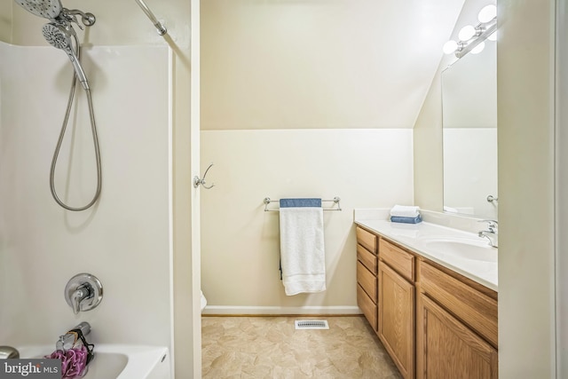 16206 Tiffany Ln, Haymarket, VA 20169 - bathroom with vanity, washtub / shower combination, and vaulted ceiling