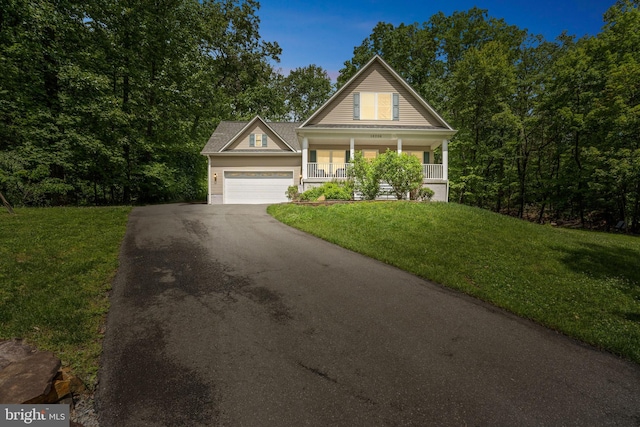 16206 Tiffany Ln, Haymarket, VA 20169 - view of front facade featuring asphalt driveway, covered porch, a garage, and a front yard