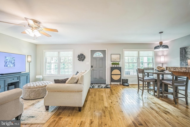 16206 Tiffany Ln, Haymarket, VA 20169 - living area with plenty of natural light, light wood-style flooring, and a ceiling fan