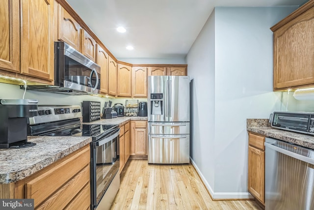16206 Tiffany Ln, Haymarket, VA 20169 - kitchen with stainless steel appliances, light wood-type flooring, and recessed lighting