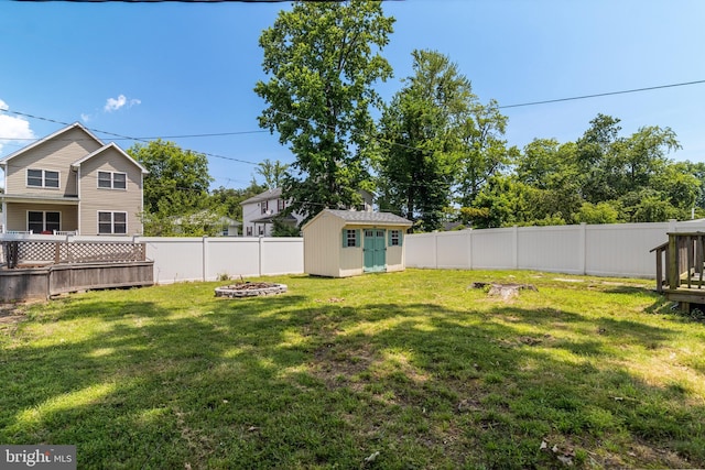 4006 6th St, North Beach, MD 20714 - fenced backyard with a storage shed and a fire pit