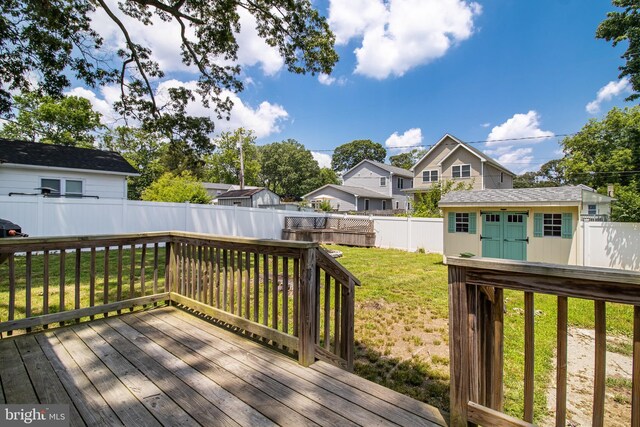 4006 6th St, North Beach, MD 20714 - wooden deck with a fenced backyard, an outbuilding, and a residential view