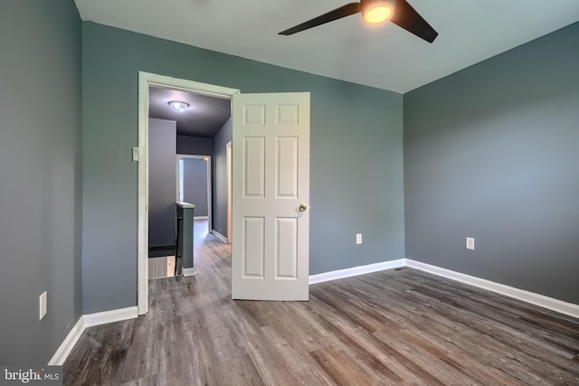 2557 W Baltimore St, Baltimore, MD 21223 - spare room featuring a ceiling fan and wood finished floors