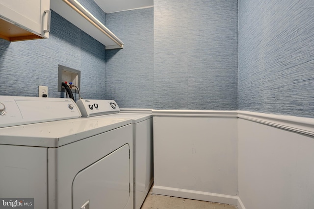 2557 W Baltimore St, Baltimore, MD 21223 - laundry room with cabinet space and washing machine and clothes dryer