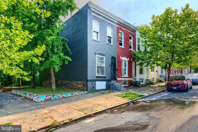 2557 W Baltimore St, Baltimore, MD 21223 - view of property featuring brick siding and entry steps
