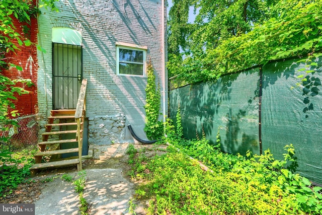 2557 W Baltimore St, Baltimore, MD 21223 - view of property exterior with brick siding and entry steps