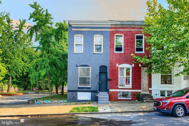 2557 W Baltimore St, Baltimore, MD 21223 - townhome / multi-family property with brick siding and entry steps