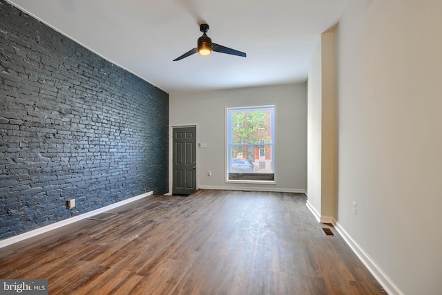 2557 W Baltimore St, Baltimore, MD 21223 - empty room featuring ceiling fan and wood finished floors