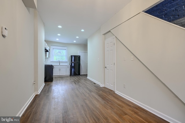 2557 W Baltimore St, Baltimore, MD 21223 - unfurnished living room with dark wood-style floors and recessed lighting