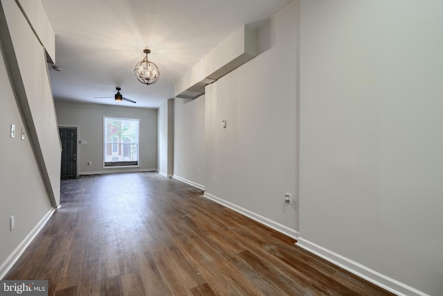 2557 W Baltimore St, Baltimore, MD 21223 - spare room with a chandelier, dark wood-type flooring, and a ceiling fan