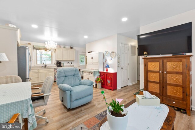 405 Confederate Blvd, Fredericksburg, VA 22401 - living room featuring a chandelier, light wood finished floors, and recessed lighting