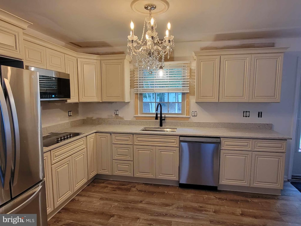 405 Confederate Blvd, Fredericksburg, VA 22401 - kitchen with stainless steel appliances, a chandelier, light countertops, and dark wood finished floors