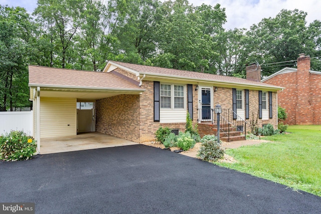 405 Confederate Blvd, Fredericksburg, VA 22401 - ranch-style house with brick siding, driveway, a chimney, a carport, and roof with shingles