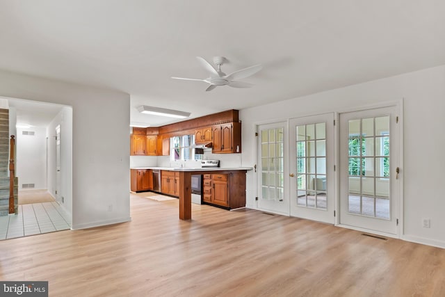 7 Forest Ln, Carlisle, PA 17015 - kitchen featuring range with electric cooktop, light wood-style floors, brown cabinets, and light countertops