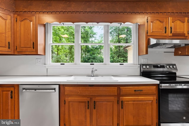 7 Forest Ln, Carlisle, PA 17015 - kitchen featuring stainless steel appliances, under cabinet range hood, light countertops, and brown cabinets