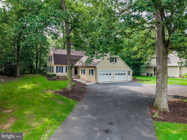 7 Forest Ln, Carlisle, PA 17015 - dutch colonial with a garage, a front lawn, asphalt driveway, and a shingled roof