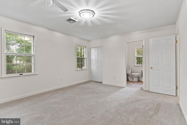 7 Forest Ln, Carlisle, PA 17015 - unfurnished bedroom with multiple windows, carpet floors, connected bathroom, and a closet