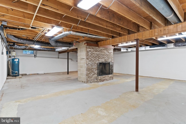7 Forest Ln, Carlisle, PA 17015 - basement with a water pressure tank and a brick fireplace