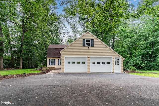 7 Forest Ln, Carlisle, PA 17015 - view of front of house featuring a chimney, roof with shingles, and driveway
