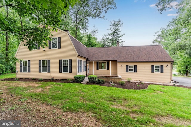 7 Forest Ln, Carlisle, PA 17015 - view of front of property featuring a front yard, roof with shingles, and a porch