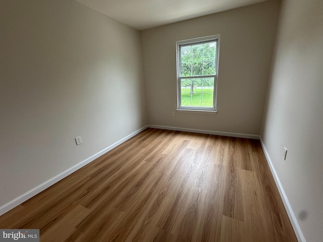 110 Hopkins Ct, Newark, DE 19713 - spare room featuring wood finished floors and baseboards
