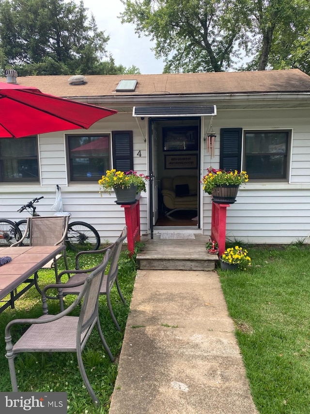 4 Highland Pl, Indian Head, MD 20640 - property entrance featuring roof with shingles and a lawn