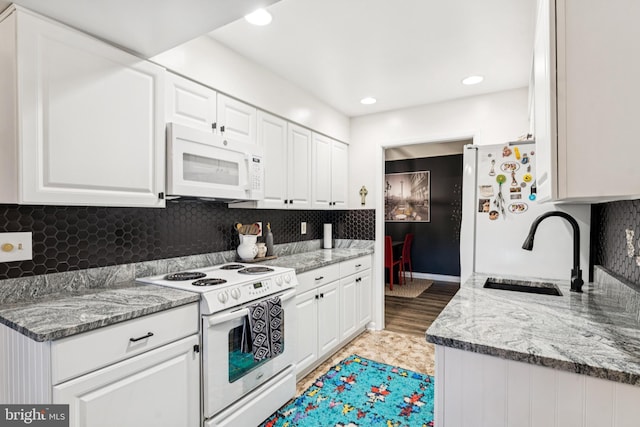 15301 Beaverbrook Ct Unit 92-3K, Silver Spring, MD 20906 - kitchen featuring white appliances, white cabinets, tasteful backsplash, and recessed lighting