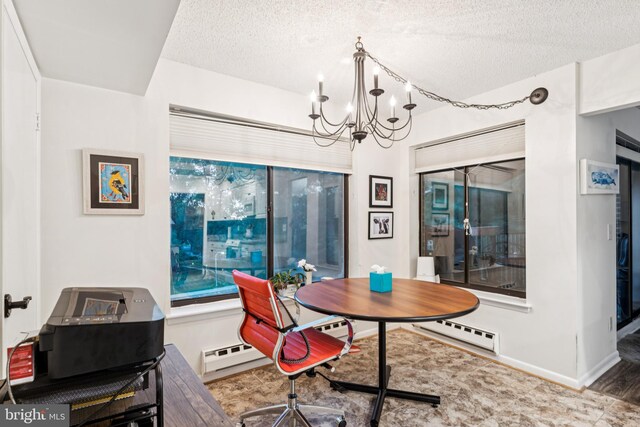 15301 Beaverbrook Ct Unit 92-3K, Silver Spring, MD 20906 - dining space with a chandelier, a textured ceiling, and a baseboard heating unit