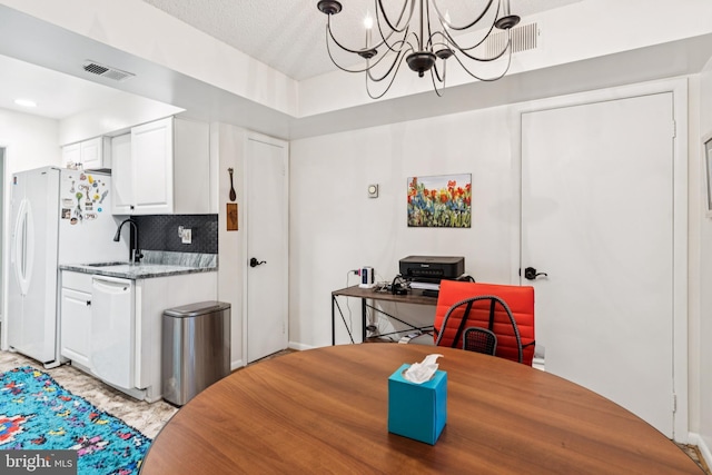 15301 Beaverbrook Ct Unit 92-3K, Silver Spring, MD 20906 - dining space featuring a chandelier and a textured ceiling
